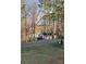 Picturesque exterior view of a lakeside house surrounded by lush trees, creating a serene and private setting at 220 Kenway Loop, Mooresville, NC 28117