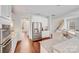 Bright kitchen features granite countertops, stainless steel appliances, and hardwood floors at 220 Kenway Loop, Mooresville, NC 28117