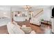 Spacious living room with hardwood floors, and views into dining, kitchen and stairs to upper level at 220 Kenway Loop, Mooresville, NC 28117
