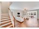 Spacious living room with stairs, hardwood floors, fireplace, ceiling fan and lots of natural light at 220 Kenway Loop, Mooresville, NC 28117