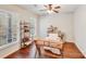 Cozy home office space with hardwood floors, bookshelves and natural light at 220 Kenway Loop, Mooresville, NC 28117
