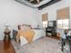 Stylish bedroom with neutral decor, industrial ductwork, and city views at 2338 Yadkin Ave # 503, Charlotte, NC 28205