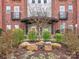 Building entrance with a stone sign, landscaping, and an awning for a welcoming first impression at 2338 Yadkin Ave # 503, Charlotte, NC 28205