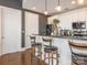 Modern kitchen with white cabinetry, granite countertops, and counter seating at 2338 Yadkin Ave # 503, Charlotte, NC 28205