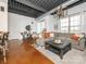 Spacious living room with exposed ceiling ductwork, modern light fixture, and large windows at 2338 Yadkin Ave # 503, Charlotte, NC 28205