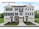 Modern townhome exterior featuring white siding, black shutters, and well-manicured front yards at 2528 Ellen Ave # 1001E, Charlotte, NC 28208