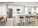 Modern kitchen featuring an island with seating, stainless steel appliances, and white cabinetry at 2545 Ellen Ave # 1017A, Charlotte, NC 28208