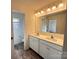 Bright bathroom featuring double sinks with a large mirror and modern vanity at 2623 Aubrey St, Monroe, NC 28110