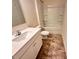 Bathroom featuring a vanity, toilet, and bathtub with tile surround at 2623 Aubrey St, Monroe, NC 28110