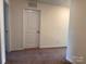 Neutral bedroom with carpeted floors, door and large closet, ample natural light at 2623 Aubrey St, Monroe, NC 28110