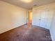 Carpeted bedroom with neutral walls and a closet at 2623 Aubrey St, Monroe, NC 28110