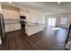 Modern kitchen featuring stainless steel appliances and a spacious island at 2623 Aubrey St, Monroe, NC 28110