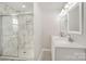 Elegant bathroom showcasing marble-like shower, double sinks, and modern fixtures at 303 Bost St, Kannapolis, NC 28081