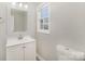 Bathroom featuring a vanity, framed mirror and a single window at 303 Bost St, Kannapolis, NC 28081