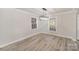 Cozy dining room with modern gray floors, neutral paint and natural light at 303 Bost St, Kannapolis, NC 28081