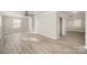 A bright dining area with modern gray floors, neutral paint and a contemporary light fixture at 303 Bost St, Kannapolis, NC 28081