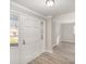 Bright entryway with natural light, modern gray vinyl floors and fresh, neutral paint at 303 Bost St, Kannapolis, NC 28081