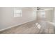 Spacious living room with modern gray floors, neutral paint and ample natural light at 303 Bost St, Kannapolis, NC 28081