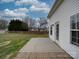 Backyard featuring concrete pad, partial fencing, vinyl siding, and some mature trees at 3114 Montcalm Ct, Monroe, NC 28110