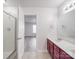 Bathroom with dual sink vanity, shower, and ample lighting at 3114 Montcalm Ct, Monroe, NC 28110