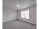 Bedroom with a window and neutral carpet at 3114 Montcalm Ct, Monroe, NC 28110