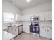 Kitchen featuring updated stainless steel appliances and modern white cabinetry at 3114 Montcalm Ct, Monroe, NC 28110