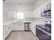 Kitchen featuring stainless steel appliances, modern white cabinetry and countertops at 3114 Montcalm Ct, Monroe, NC 28110