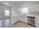 Bright kitchen featuring stainless appliances, white cabinets and ample countertop space at 3114 Montcalm Ct, Monroe, NC 28110