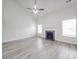 Large living room showcasing a fireplace, neutral walls, and modern, light-colored flooring at 3114 Montcalm Ct, Monroe, NC 28110