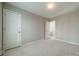 Neutral bedroom with carpet, closet, and entry door at 3554 Laurenhurst Ln, Charlotte, NC 28270