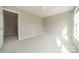 Bedroom with a bright window, carpet and a closet at 3554 Laurenhurst Ln, Charlotte, NC 28270