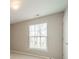 Bedroom with a window and neutral colored walls and carpet at 3554 Laurenhurst Ln, Charlotte, NC 28270