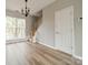 Bright dining area featuring a chandelier, staircase, and hardwood floors at 3554 Laurenhurst Ln, Charlotte, NC 28270