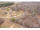 Aerial view of wooded acreage, with a long driveway leading to the residence at 4187 Bessie Hudson Rd, Lancaster, SC 29720