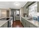 Bright kitchen with stainless steel appliances, green cabinetry, and abundant counter space at 4187 Bessie Hudson Rd, Lancaster, SC 29720