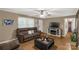 Cozy living room with hardwood floors, a sofa, and a TV above a fireplace, creating a relaxing space at 4187 Bessie Hudson Rd, Lancaster, SC 29720