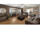 Inviting living room with open layout to dining and kitchen, featuring hardwood floors and neutral decor at 4187 Bessie Hudson Rd, Lancaster, SC 29720