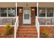 Close up of the front porch with painted white railing with the house number above the door at 4187 Bessie Hudson Rd, Lancaster, SC 29720