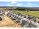 Aerial view of a well-planned community with houses, green spaces, and a tree line in the background at 4233 Poplin Grove Dr, Indian Trail, NC 28079