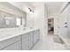 Bright bathroom with double vanity, framed mirror, and glass shower at 4233 Poplin Grove Dr, Indian Trail, NC 28079