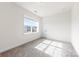 Inviting bedroom featuring a large window providing natural light and plush carpeting for added comfort at 4233 Poplin Grove Dr, Indian Trail, NC 28079