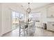 Bright dining area with sliding glass doors to the patio and modern lighting at 4233 Poplin Grove Dr, Indian Trail, NC 28079