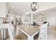 Open-concept dining area with views into the kitchen and living room, perfect for entertaining at 4233 Poplin Grove Dr, Indian Trail, NC 28079