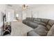 Spacious living room features plush carpeting, a large sectional sofa, and modern television setup at 4233 Poplin Grove Dr, Indian Trail, NC 28079