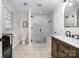 Beautiful bathroom featuring a glass shower with bench, neutral paint, and updated fixtures at 5019 Crooked Oak Ln, Charlotte, NC 28226