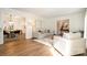 Living room showcasing an open floor plan with hardwood floors leading to the dining area and foyer at 5019 Crooked Oak Ln, Charlotte, NC 28226