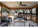 Relaxing covered porch with overhead fan and comfortable seating at 5019 Crooked Oak Ln, Charlotte, NC 28226