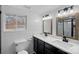 Bright bathroom featuring a double vanity, shiplap walls, and modern fixtures at 504 Leland St, Charlotte, NC 28214