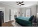 Comfortable bedroom with a large window, ceiling fan, and ample natural light at 504 Leland St, Charlotte, NC 28214