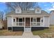 Charming home with a covered front porch and two dormer windows, offering a welcoming curb appeal at 504 Leland St, Charlotte, NC 28214